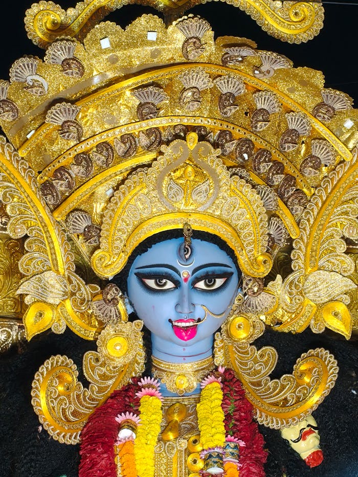services-bg Vibrant Hindu goddess idol with intricate golden details and colorful adornments.